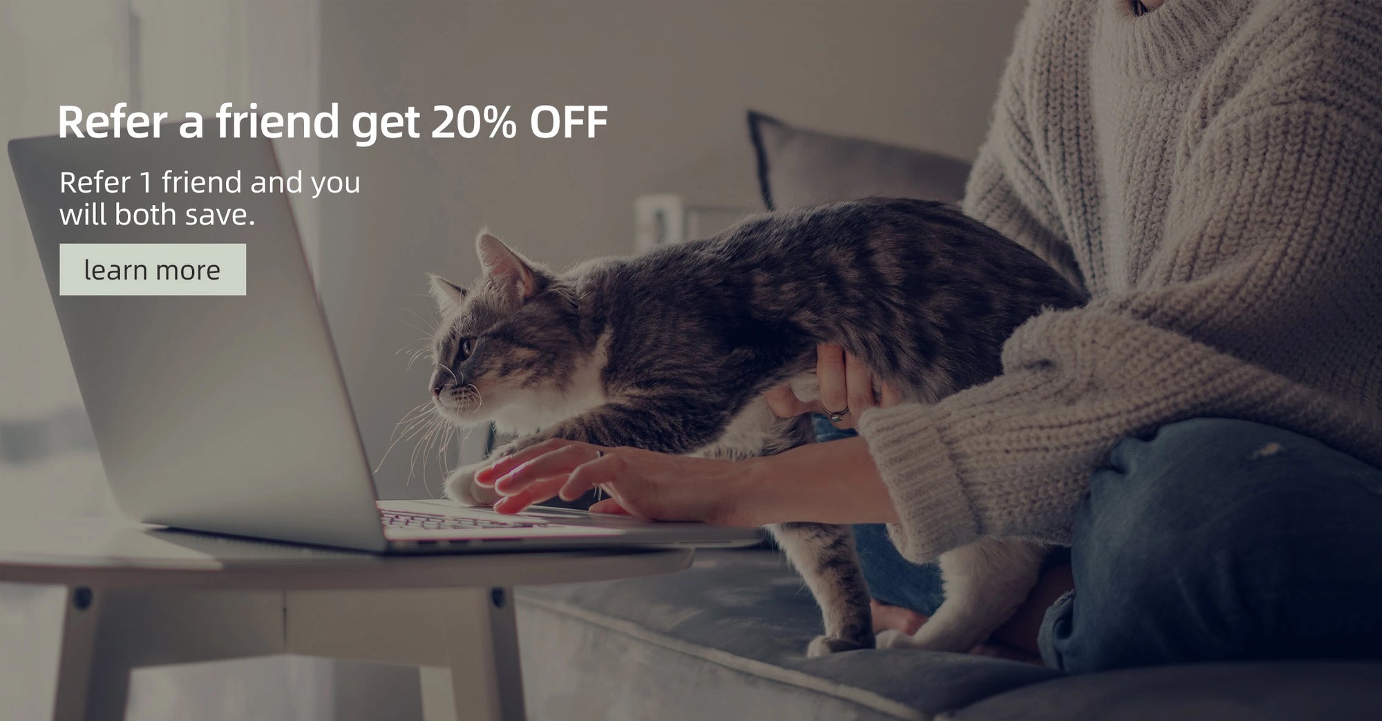 Person using a laptop with a cat on their lap, promotional text overlay for referring a friend.