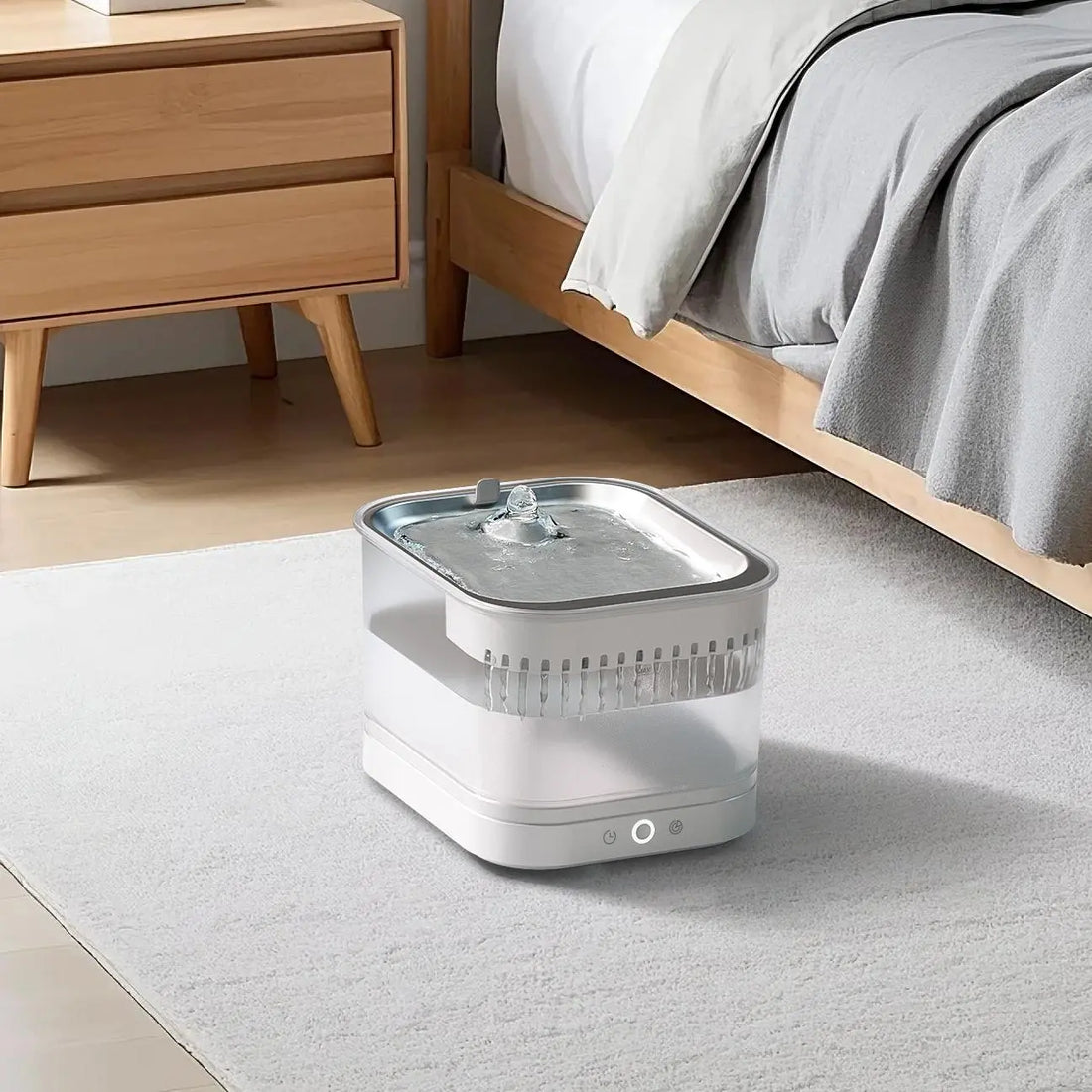 A serene, minimalist white cat water fountain in a peaceful setting