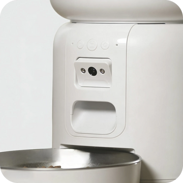 A close-up of the camera and Bluetooth indicator light on a smart cat feeder.