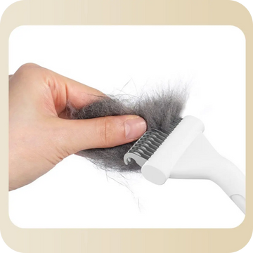 Easy-clean de-matting rake releasing collected pet hair after grooming