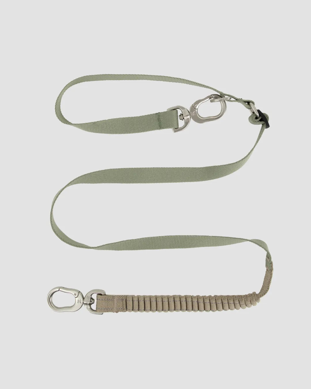 Dog leash in green color with elastic bungee section, metal swivel clip, and sturdy nylon strap
