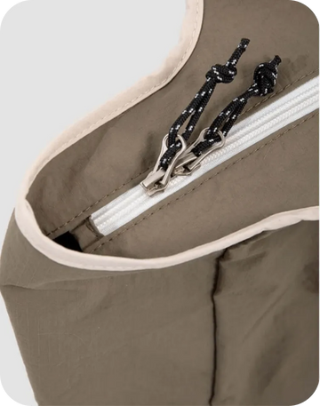 Durable zipper pocket detail on portable cat carrier bag for secure storage