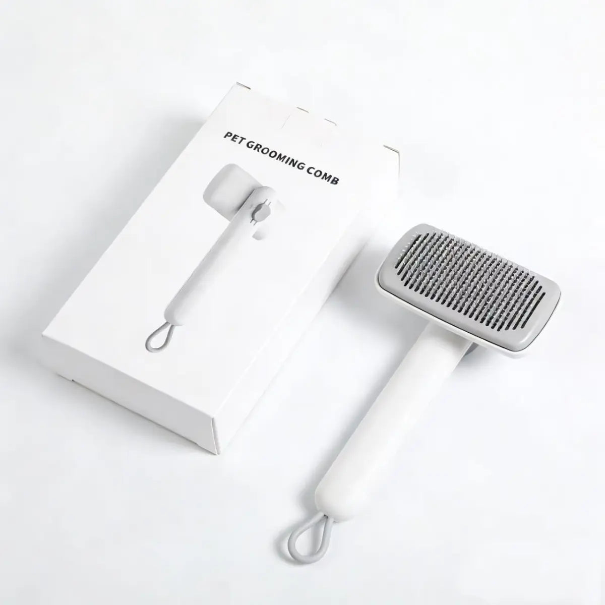 Pet grooming comb packaged in box, self-cleaning cat brush designed for shedding control and daily cat care